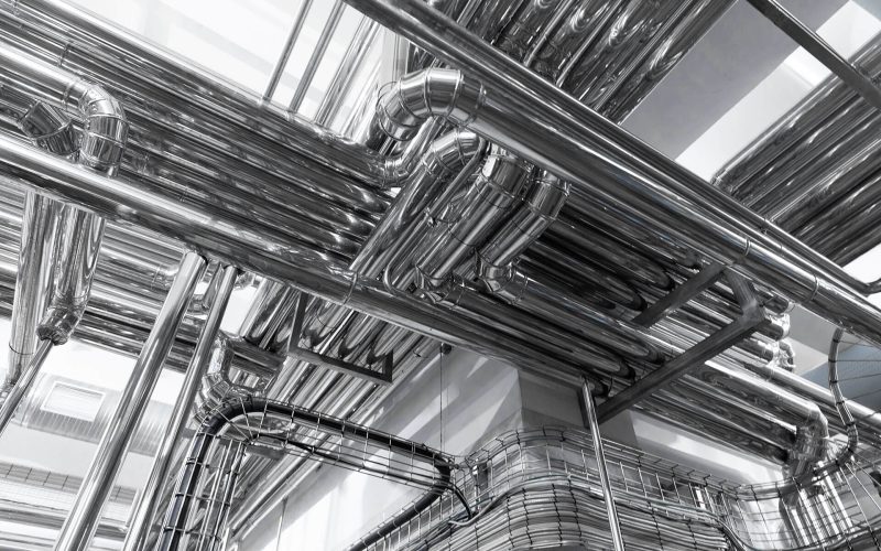chrome-pipes-close-up-industrial-background-2023-02-10-10-28-50-utc